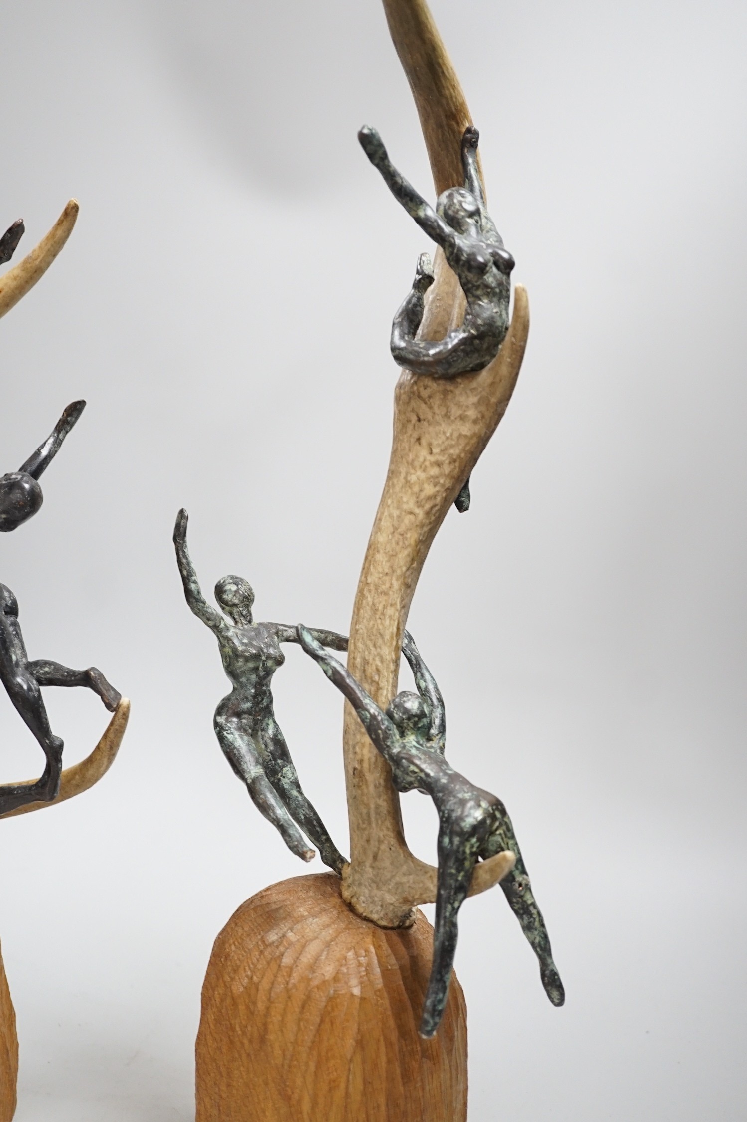 A pair of bronze and antler dancer groups in the style of Edgar Degas, 49cms high